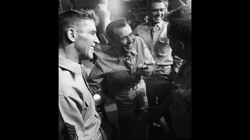 After his 1940s success, Sinatra's career hit the skids in the early '50s. He was dropped by his movie studio and clashed with his record label, and he had split with his wife to marry actress Ava Gardner. His performance in 1953's "From Here to Eternity," for which he won an Oscar for best supporting actor, was his comeback. Here, Sinatra shares a much-needed laugh with co-stars Burt Lancaster, Ernest Borgnine and Mickey Shaughnessy in between takes of one of the movie's tensest scenes.