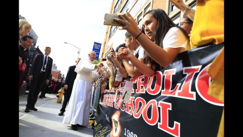 Pope Francis greets the crowd in New York's East Harlem Neighborhood on September 25.