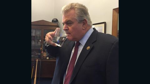 Rep. Bob Brady in his office with a glass of water previously used by Pope Francis.