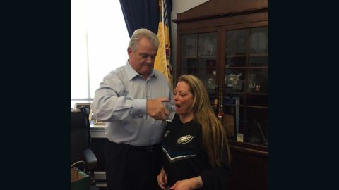 Rep. Bob Brady in his office sharing a glass of water previously used by Pope Francis with his wife, Debra Brady.