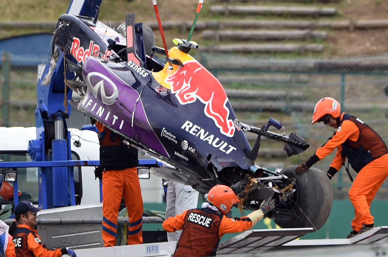 The race car of Red Bull driver Daniil Kvyat of Russia is moved onto a truck after his crash in the qualifying session at the Formula One Japanese Grand Prix in Suzuka.