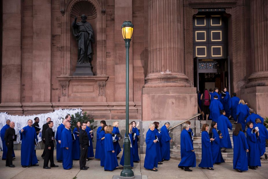 Members of the choir arrive at Cathedral Basilica of Saints Peter and Paul prior to the arrival of Pope Francis on September 26.