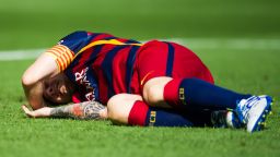 Lionel Messi of FC Barcelona lays injured on the pitch during the La Liga match between FC Barcelona and UD Las Palmas at Camp Nou on September 26, 2015 in Barcelona, Spain. (Photo by Alex Caparros/Getty Images)