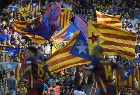 Barcelona fans wave flags to show their support for Catalan independence during Saturday's match against Las Palmas.