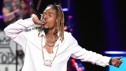 Rapper Fetty Wap performs with Fall Out Boy at the 2015 iHeartRadio Music Festival at MGM Grand Garden Arena on September 19, 2015 in Las Vegas, Nevada.