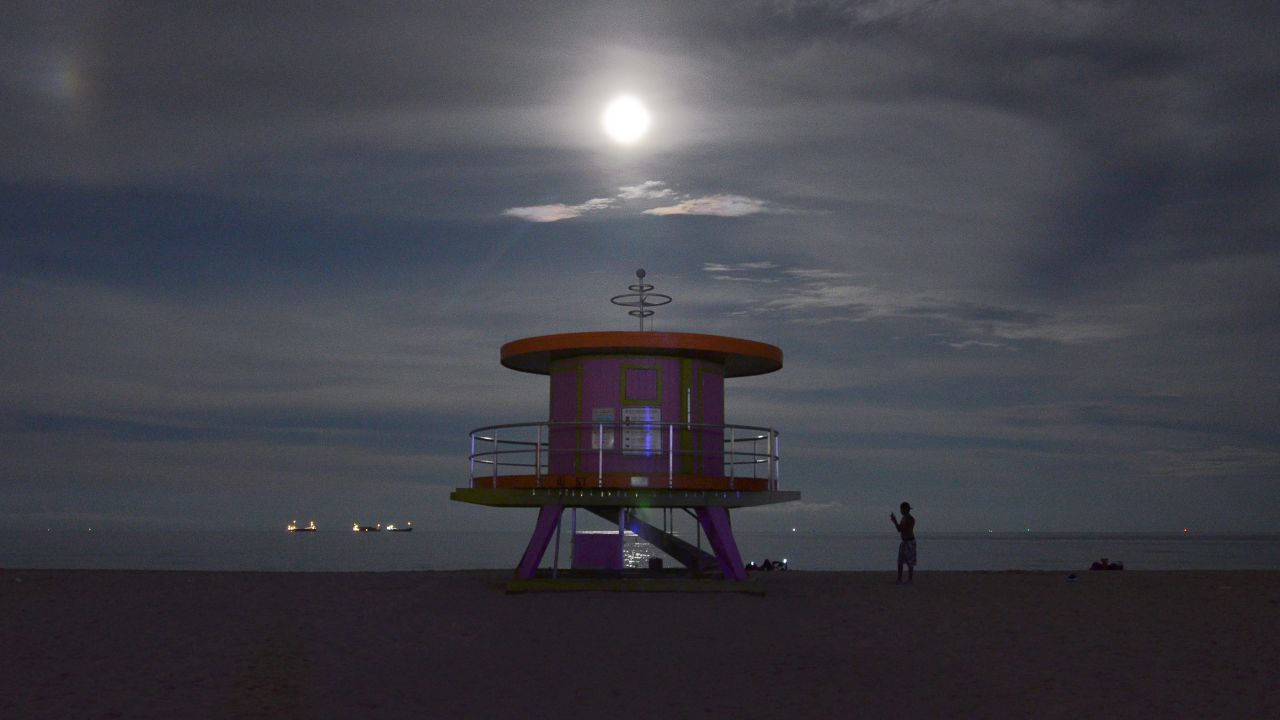 The supermoon rises over Miami Beach.
