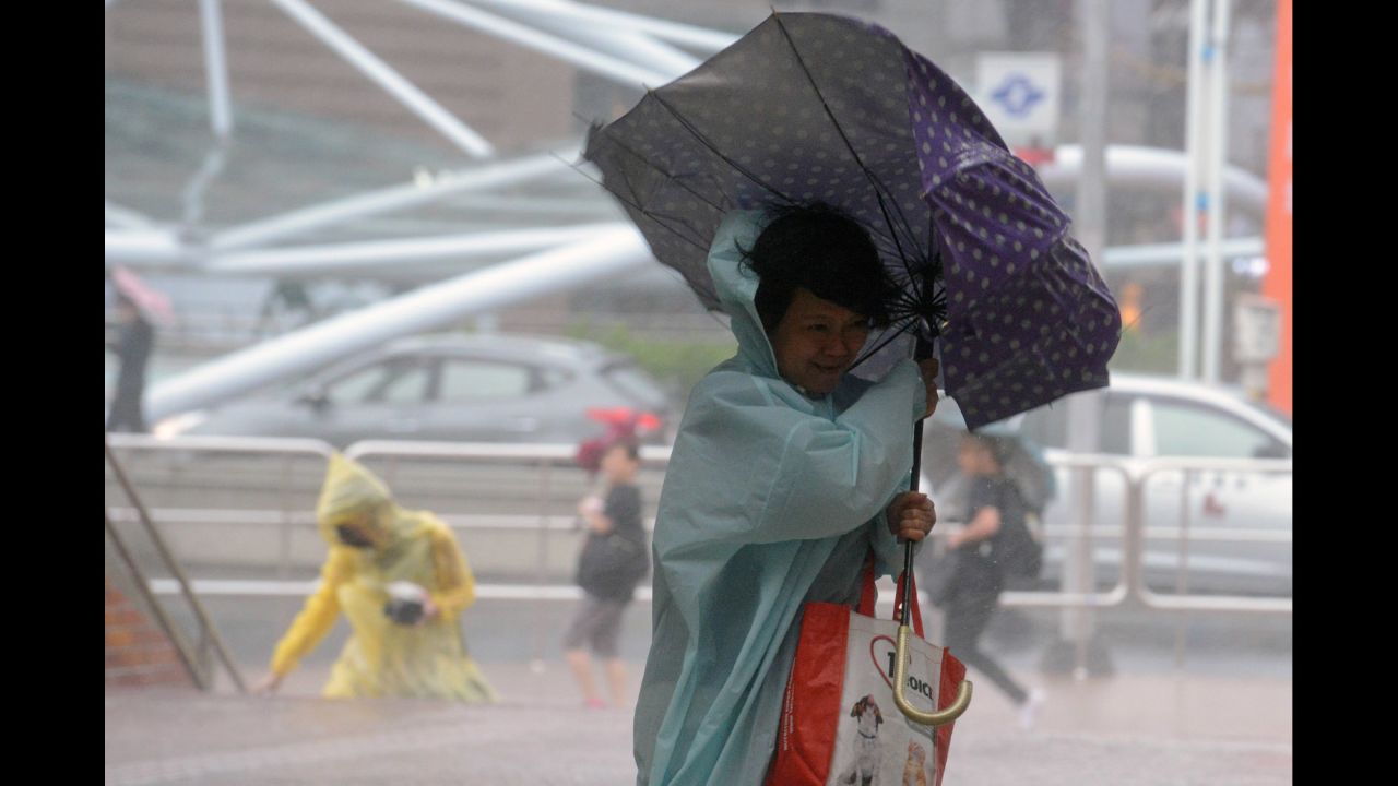 A woman fights strong winds in New Taipei City on September 28.