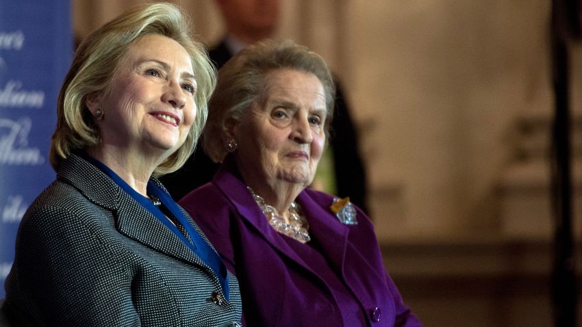 Former US Secretaries of State Hillary Clinton (L) and Madeleine Albright listen to a speaker after Clinton received the 2013 Lantos Human Rights Prize during a ceremony on Capitol Hill in Washington on December 6, 2013.   AFP PHOTO/Nicholas KAMM        (Photo credit should read NICHOLAS KAMM/AFP/Getty Images)