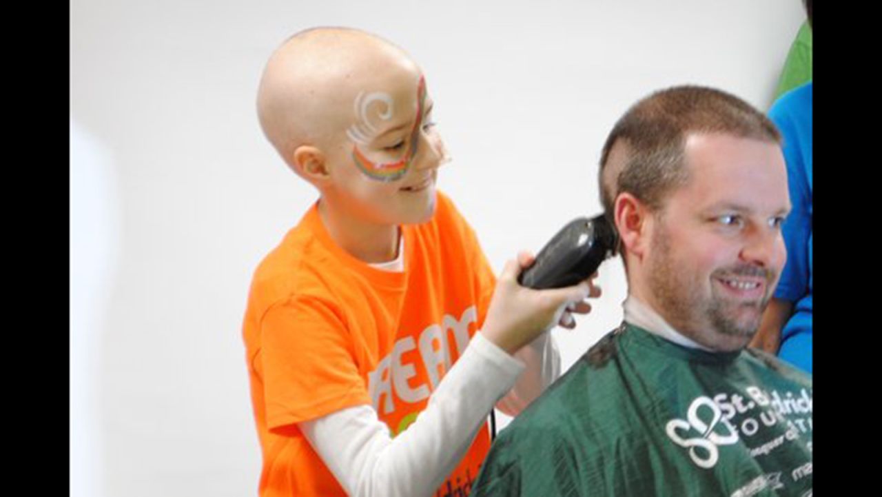 The Dove family became involved with the <a href="http://www.stbaldricks.org/" target="_blank" target="_blank">St. Baldrick's Foundation</a>, a volunteer organization dedicated to fund-raising for childhood cancer research. In 2014, the Doves attended a local head-shaving event, where Lily was honored and all of them shaved their heads. This year, they participated in another event and their team raised $27,000 for childhood cancer research. Bailey was feeling well that day and even shaved her father's head. 