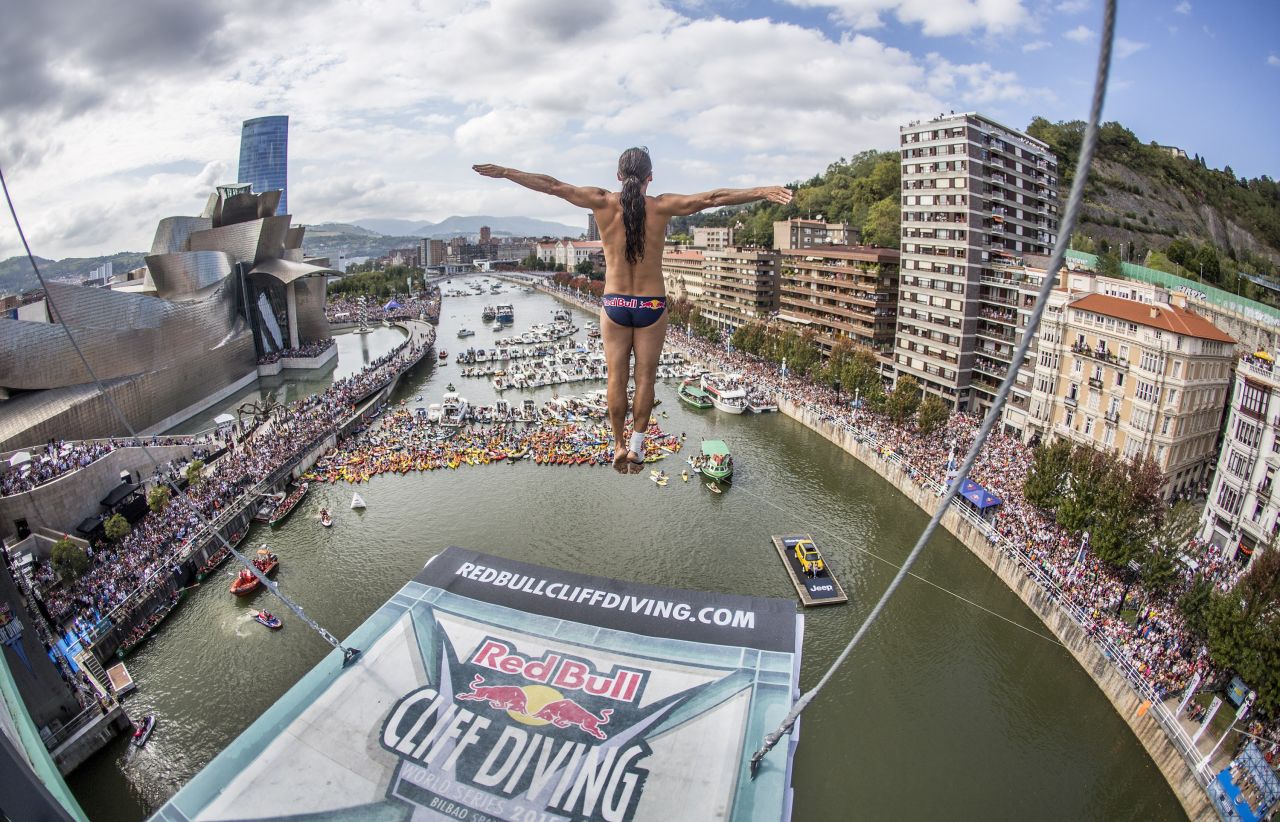 Duque looks down at the Nervion river from his position on La Salve Bridge. The  27-meter platform is three times the height of an Olympic diving board.
