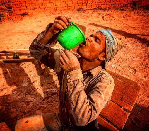 Kashmir-based video journalist <a href="https://instagram.com/imranmanzoorshah/" target="_blank" target="_blank">Imran Shah</a> took a stunning set of Instagrams of laborers at a brick kiln in Budgam, Indian Kashmir.<br /><br />Imran Shah: "Brick making is an unorganized industry, generally confined to rural areas and is one of the largest employment industries in India. The laborers usually work in hard conditions for 12-14 hours a day, earning less than $150 a month. The emission of a huge quantity of toxic elements is causing serious health hazards to workers, with most suffering from respiratory or skin problems."<br /><br />CNN Travel producer Maureen O'Hare: "The parched, dusty reds contrast with the hydrating green bucket, giving a visceral sense of the harsh working conditions at the brick kiln." 