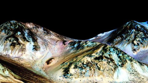 Water still flows across the surface of Mars from time to time, NASA scientists said in 2015. In the photo above, dark, narrow streaks called recurring slope lineae are seen flowing downhill on Mars. Scientists have inferred that they were formed by contemporary flowing water.