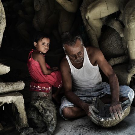 Instagrammer <a href="https://instagram.com/ayanava3/" target="_blank" target="_blank">Ayanava Sil</a> snapped this striking shot of an artisan and his granddaughter in north Calcutta's potter's colony, Kumartuli. <br /><br />"In these lanes, one sees hundreds of potters and artisans who are involved in making thousands of (religious) idols each year," said Sil.<br /><br />"What attracted me to the scene is how the artisan's granddaughter keeps an eye on every passer-by -- the way she stares completes the picture."<br /><br />CNN Travel producer Maureen O'Hare: "Your eyes are immediately drawn to this young girl's challenging, confident stare. She's making sure no one messes with her or her grandfather." 