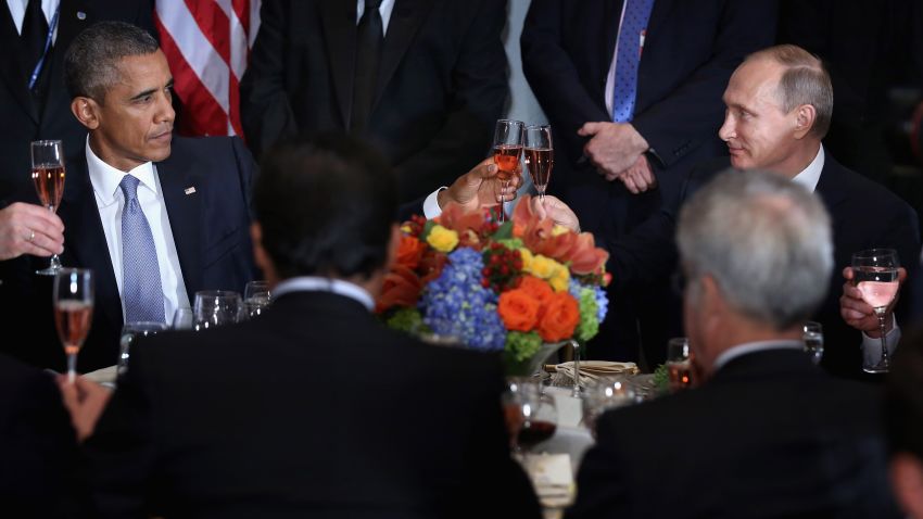 President Barack Obama (left) and Russian President Valdimir Putin toast during a luncheon hosted by United Nations Secretary-General Ban Ki-moon during the 70th annual UN General Assembly on September 28, 2015, in New York City.