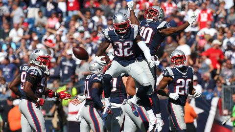 New England safety Devin McCourty (No. 32) celebrates with teammate Duron Harmon after intercepting a pass against Jacksonville on Sunday, September 27.