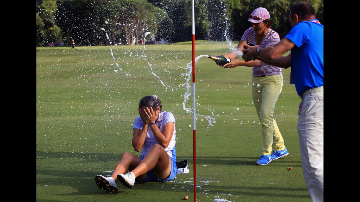 Celine Herbin gets sprayed with champagne after winning the Lacoste Ladies French Open on Sunday, September 27.