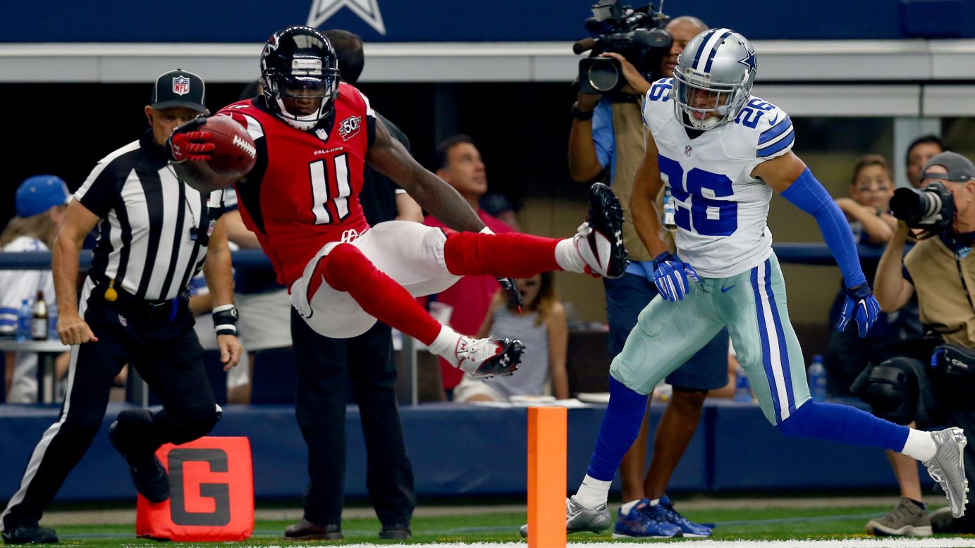 Atlanta wide receiver Julio Jones leaps over the goal line for a third-quarter touchdown at Dallas on Sunday, September 27. Jones had 12 catches for 164 yards and two touchdowns as the Falcons won 39-28.
