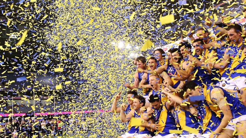 Confetti flies on Williamstown players after the Australian rules football club won the grand final of the Victorian Football League on Sunday, September 27.
