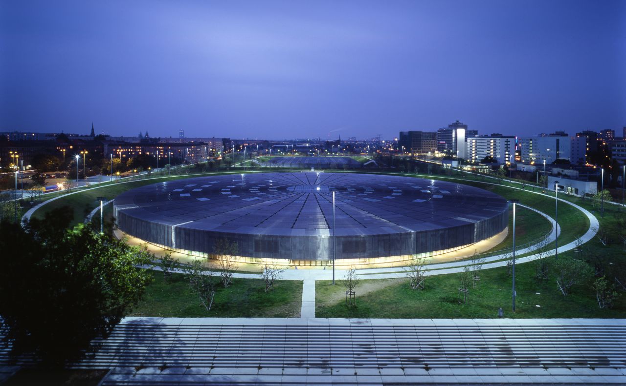 Berlin's Velodrome and Olympic Swimming Pool continue Perrault's sunken motif, with both structures (the swimming pool is in the background) "immersed" and flanked by an apple orchard. 