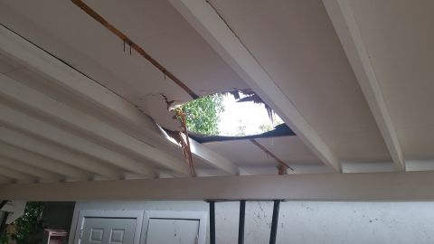 The marijuana bundle tore a hole in the family's carport roof.