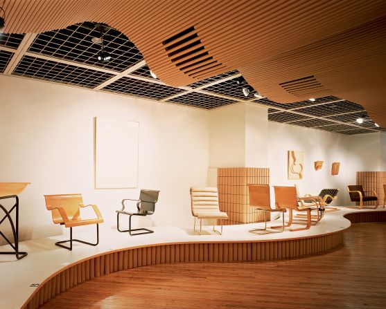 "This exhibition of furniture and glass works by Alvar Aalto was programmed by the Museum of Modern Art in New York. Although the intention was to design an exhibition space, which would reflect an Aalto interior, budgetary limitations prevented the extensive use of wood in the same style as the Finnish master... In order to avoid the expense and the inevitable waste of resources, recycled paper tubing was adopted as alternative material and was used to create ceiling panels, partitions, and display stands. The material explorations in this exhibit design mark the beginning of 'paper architecture.'"