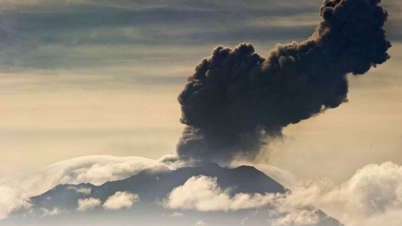 Picture taken on April 3, 2014 showing the Ubinas volcano spewing ash, as seen from Arequipa, some 1000 km south of Lima. Residents have fled villages near Peru's Ubinas volcano, which this week began spitting out white hot chunks of rock, some as big as 30 centimeters in diametre, a local scientific committee announced on April 11, 2014. The renewed activity led the government to announce a state of emergency in the Andean region of Moquegua, some 1,200 kilometers south of Lima. Officials plan to distribute food, face masks and goggles to help those upwind of the volcano cope with airborne ash.  AFP PHOTO/ERNESTO BENAVIDES        (Photo credit should read ERNESTO BENAVIDES/AFP/Getty Images)