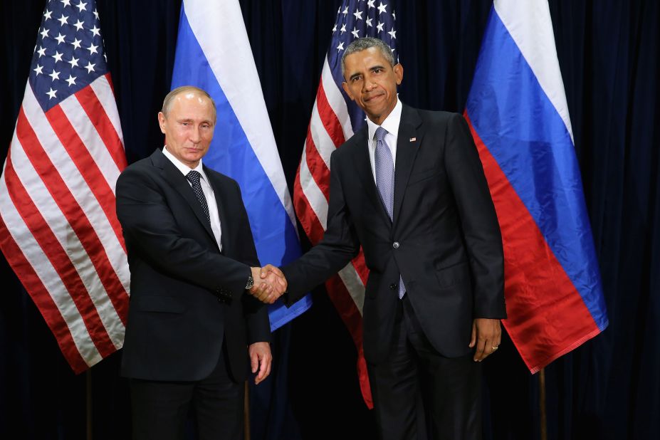 Obama and Putin shake hands while posing for a photo ahead of their meeting at U.N. headquarters on September 28 in New York.