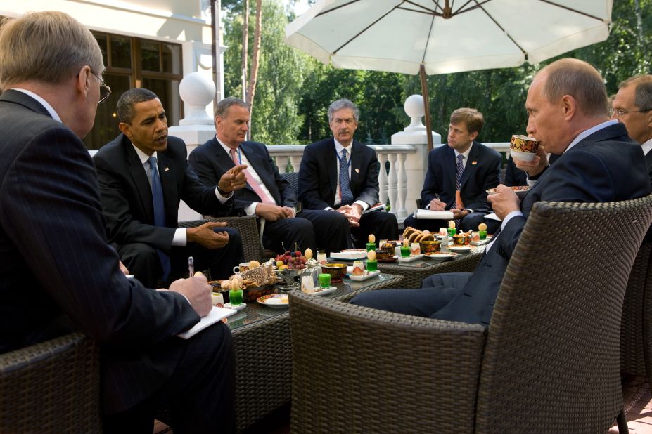 Obama, who had become U.S. President six months earlier, enjoys tea with then-Prime Minister Vladimir Putin and members of the American delegation at Putin's dacha on July 7, 2009 in Moscow.
