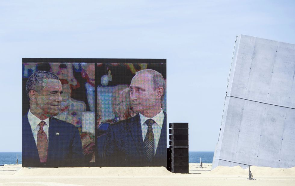 Obama and Putin share a comical and awkward moment on a large split-screen during an international ceremony on the stretch code-named Sword Beach, in Ouistreham, France, to commemorate the Allied invasion of Normandy on June 6, 2014. Obama and Putin had an informal 15-minute chat during lunch at the ceremony that marked the 70th anniversary of the D-day landings. "It's a positive thing that they spoke, but more needs to be done," a senior U.S. official said at the time.