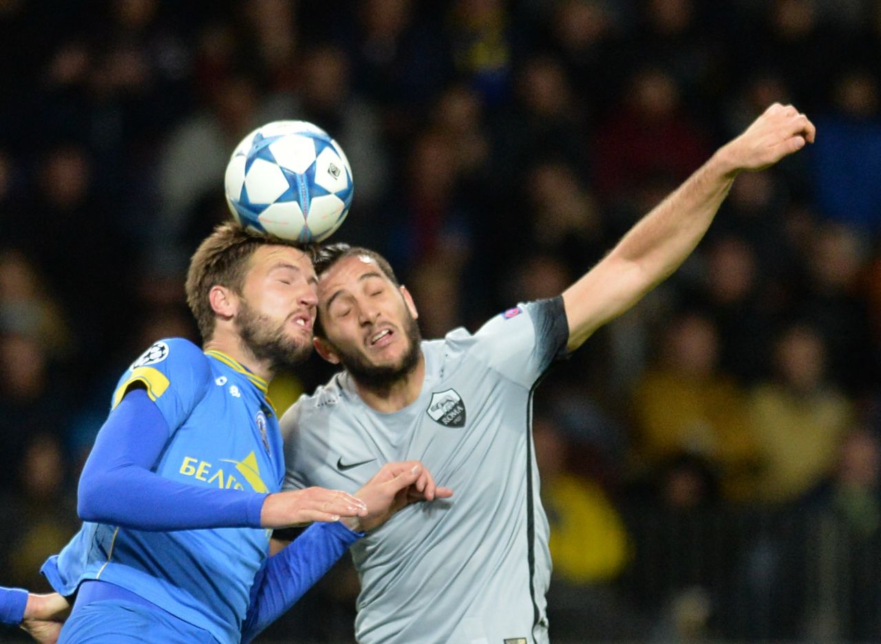 Nemanja Milunovic (left) fights for the ball with Roma's Greek defender Konstantinos Manolas -- BATE Borisov claimed a shock victory in the Group E match, scoring three times in the first half.