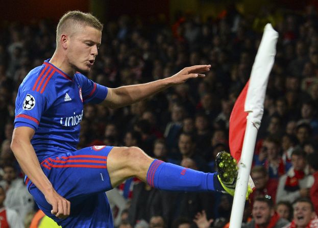 Olympiakos' Icelandic striker Alfreo Finnbogason celebrates scoring the Greek side's second-half winner away to English team Arsenal, which suffered its second successive Group F defeat. 