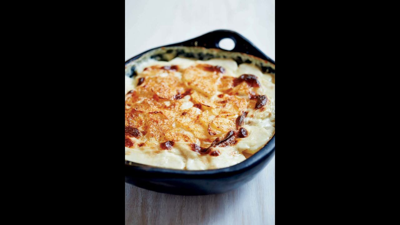 These comforting potatoes au gratin were part of Reichl's Christmas present to herself, paired with a 7-pound dry-aged prime rib roast and sauteed spinach to cut the richness.