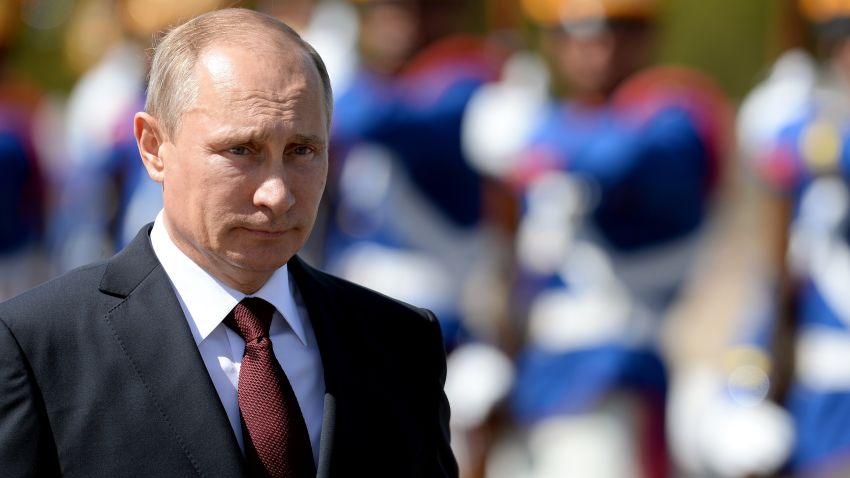 Russian President Vladimir Putin receives military honours during the welcoming ceremony at Planalto Palace in Brasilia on July 14, 2014. Putin is in Brazil to attend the BRICS summit. AFP PHOTO/EVARISTO SA        (Photo credit should read EVARISTO SA/AFP/Getty Images)