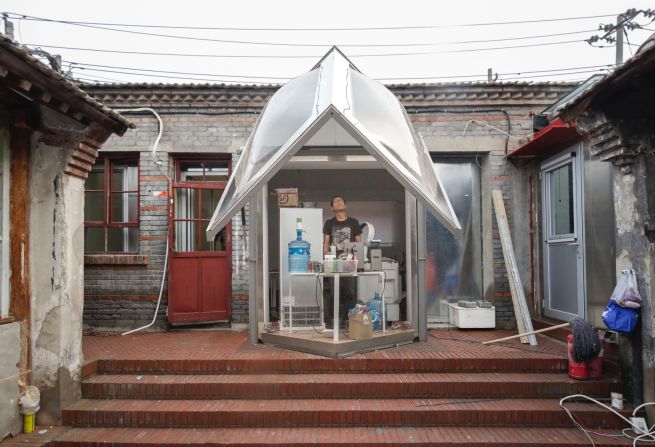 This is another example of People Architecture Office's courtyard plug-ins. The design of this mechanized door allows for a more efficient use of space. The local government is now helping to financially back the project. PAO is in the process of designing more of these plug-ins for residents in the neighborhood.