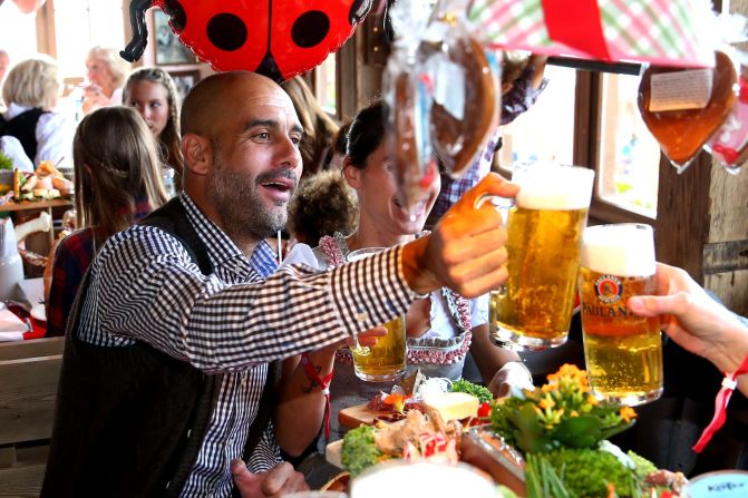 Last December, while still taking time away from football, Tuchel met Pep Guardiola (pictured) at a bar in Munich. The bar is a favored haunt of Bayern Munich players, the team of which Guardiola is head coach. The two discussed football at length, with waiting staff wary of interrupting the intense discussion. Here, Guardiola -- revered for his all-conqeuring time as Barcelona coach between 2008 and 2012 -- enjoys a Oktoberfest drink, dressed in traditional Bavarian attire. Guardiola and Tuchel will be in opposing dugouts when Bayern and Dortmund go head-to-head on Sunday.
