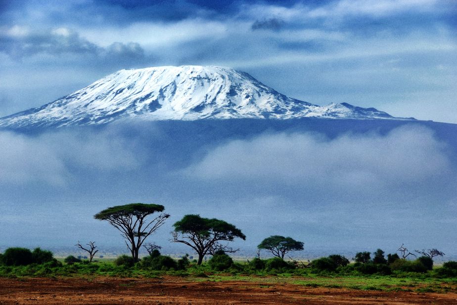 At 19,340 feet, Kilimanjaro is Africa's highest peak, but the climb to the top is surprisingly accessible and can take as little as 4-5 days on the so-called "fast route." In fact, the fastest ever summit was achieved by Italian Bruno Brunod, who managed to reach the peak in 5 hours 38 minutes.<br /><br />The journey to the top from the steppes below takes in all manner of ecosystems, stretching from agrarian landscapes to rainforest, heath to alpine desert before arctic conditions at the summit. At the top of the mountain lies a simple wooden box in which climbers can record their thoughts.