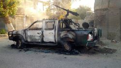 A burnt-out police pick-up truck stands in the street after Afghan security forces retook control of Kunduz city from the Taliban militants in northeastern Kunduz province, on October 1, 2015.  Afghan forces retook control of the strategic northern city of Kunduz on October 1 after a three-day Taliban occupation that dealt a stinging blow to the country's NATO-trained military.    AFP PHOTO        (Photo credit should read STR/AFP/Getty Images)