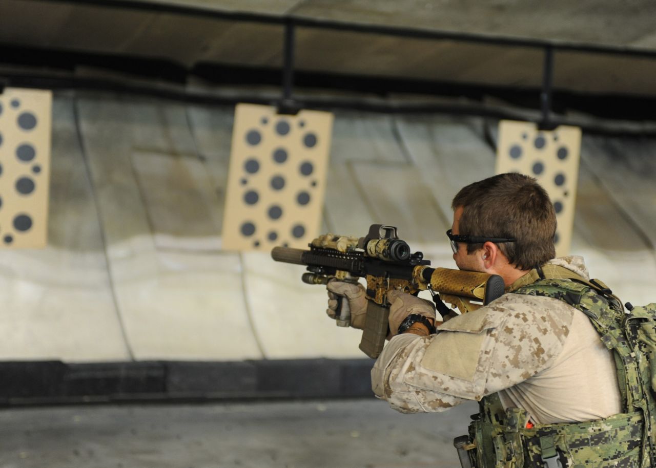 <strong>2. They generally have eight years of experience in the conventional military</strong><br /><br />In this photo, an East Coast-based U.S. Navy SEAL practices shooting drills at the Naval Special Warfare Eagle Haven Indoor Shooting Range on Joint Expeditionary Base Little Creek-Fort Story in 2013. 