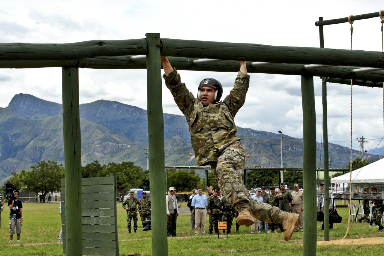 <strong>5. They know how to speak another language beside English</strong><br /><br />Pictured are Special Operations forces from the United States working their way across monkey bars on June 10, 2012, during the obstacle course portion of Fuerzas Comando 2012. 