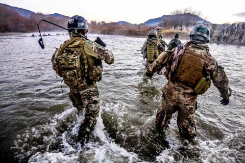 <strong>8. They provide aid in humanitarian crises when other forces are not available</strong><br /><br />In the photo, U.S. Special Forces members cross a wide river during a clearance operation in Zabul province, Afghanistan, in December 2013.