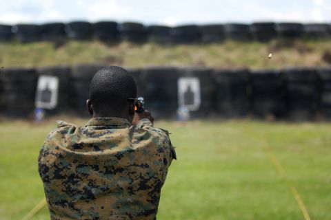 <strong>4. They have their own university -- and are likely to have a college degree</strong><br /><br />In this photo, a member of the Special Operations forces team from the Bahamas practices firing a pistol during weapons familiarization for Fuerzas Comando at the Colombian National Training Center, June 4, 2012.
