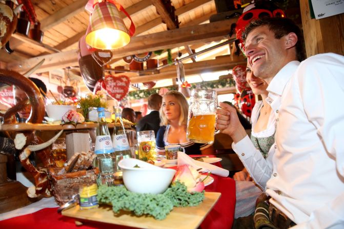 You can understand why Germany won the World Cup in 2014. Ever the professional, Muller has not one, but two bottles of water ready to be drunk in between sips of beer.