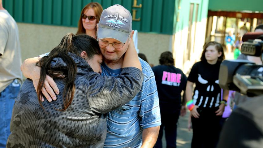 Friends and family are reunited with students at the county fairgrounds after a deadly shooting at Umpqua Community College in Roseburg, Oregon, on Thursday, October 1.