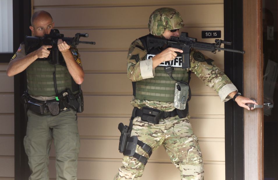 Authorities secure the campus after the shooting on October 1.