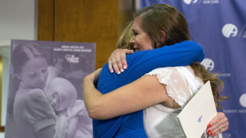 Amanda Scarpinati, right, hugs Susan Berger during a news conference in Albany, New York, on Tuesday, September 29. Berger was the nurse who cared for Scarpinati in the hospital when she suffered severe burns as an infant. Scarpinati had photos of her and the nurse from 1977, but she never knew the nurse's identity <a href="http://www.cnn.com/2015/09/29/health/burn-victim-nurse-reunion/" target="_blank">until the photos went viral on Facebook.</a> 