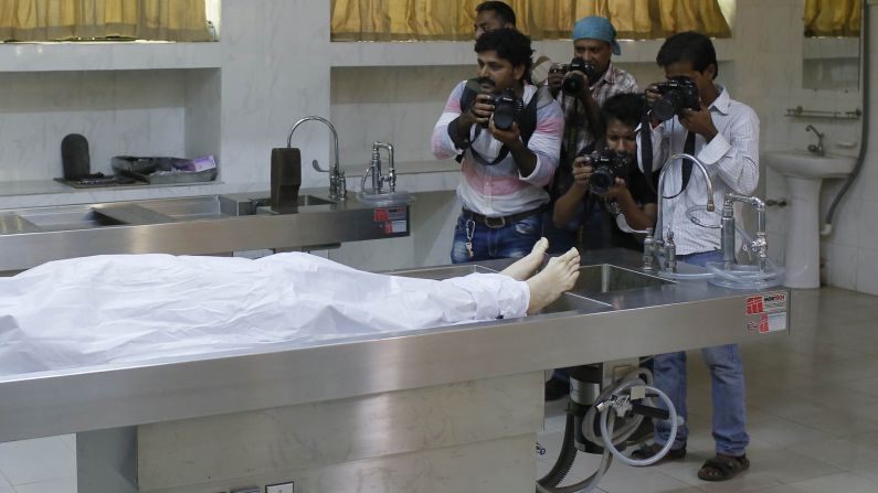 Journalists take photos of Cesare Tavella, a 51-year-old Italian <a href="http://www.cnn.com/2015/09/29/asia/bangladesh-isis-italian-killed/" target="_blank">who was gunned down</a> as he jogged home Tuesday, September 29, in Dhaka, Bangladesh. The ISIS militant group claimed responsibility for the killing.