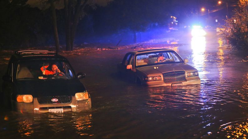 Stranded motorists make calls from their cars as they wait to be rescued Tuesday, September 29, in Roanoke, Virginia. Steady rain flooded area streets.