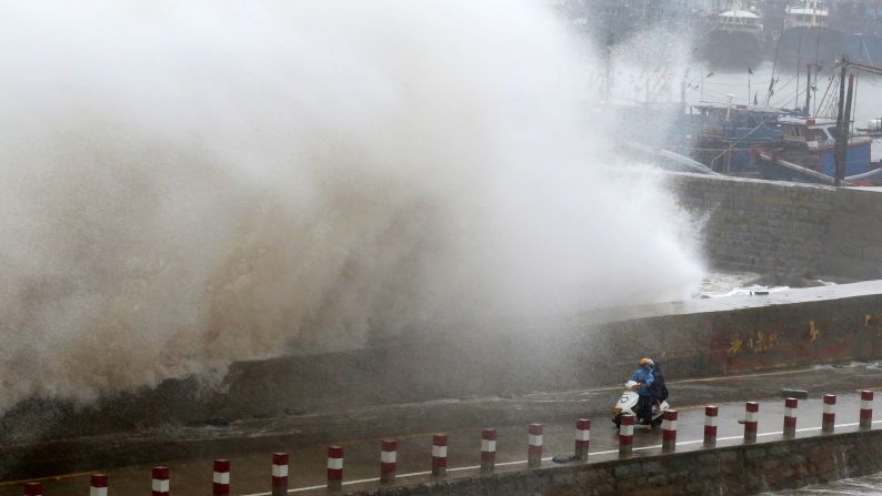 A huge wave crashes over a pier's wall in Quanzhou, China, on Tuesday, September 29. <a href="http://www.cnn.com/2015/09/29/asia/typhoon-dujuan/" target="_blank">Typhoon Dujuan</a> walloped Taiwan with howling winds and sheets of rain, killing at least two people and injuring more than 300 before heading on to mainland China.
