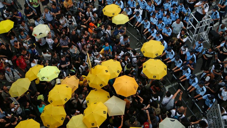 Protesters holding yellow umbrellas gather for a moment of silence to mark the first anniversary of the "Umbrella Movement" in Hong Kong on Monday, September 28. Last year, thousands of protesters <a href="http://www.cnn.com/2015/09/27/asia/hong-kong-protests-one-year-later/" target="_blank">occupied Hong Kong's financial district</a> to demand true universal suffrage -- one person, one vote, without the interference of Beijing.