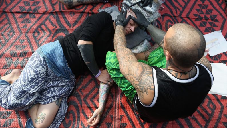 A man at the London Tattoo Convention is given a traditional Samoan tattoo on Friday, September 25.